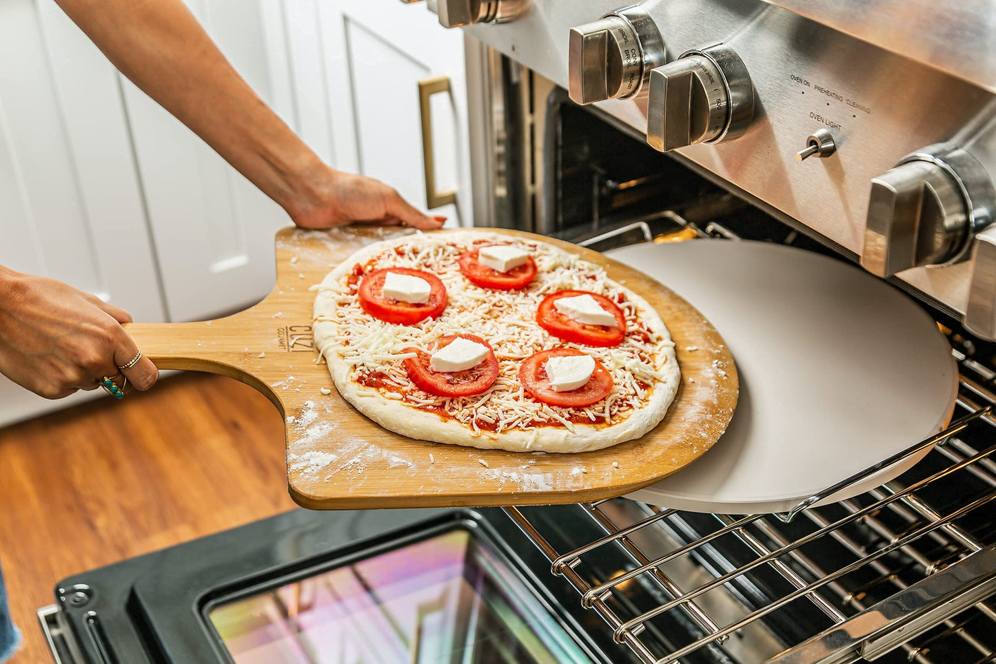 Cuzi Gourmet XL 4-Piece Pizza Stone Set - 15" Thermal Shock Resistant Cordierite Baking Stone, 22" Natural Bamboo Peel & Cutter Rocker - Large Stone for Grill and Oven
